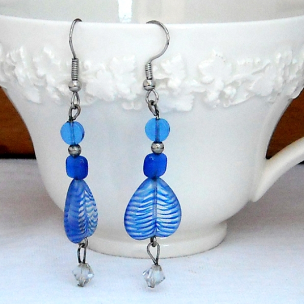 These are glass hearts upside down. I added blue beads above the heart. I dangled a clear crystal on the bottom. $12